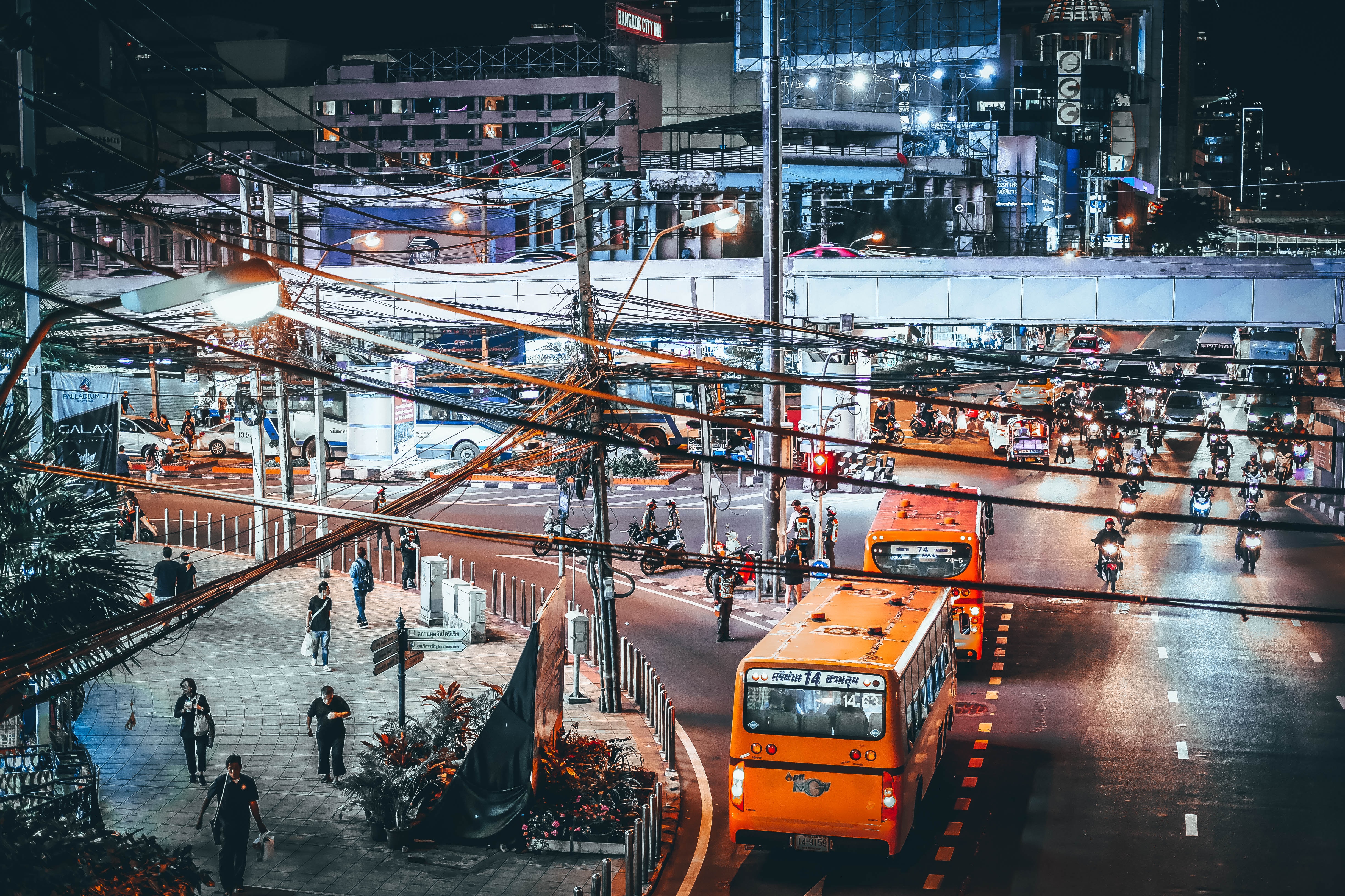 A Street with People and Buses