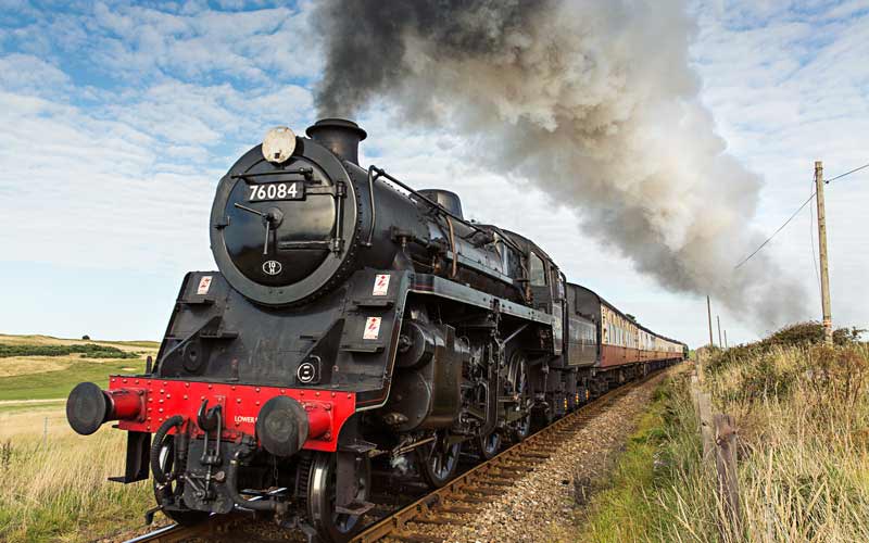 An Old Steam Train blowing Smoke